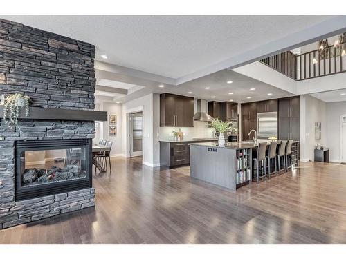 163 Cranarch Circle Se, Calgary, AB - Indoor Photo Showing Living Room With Fireplace