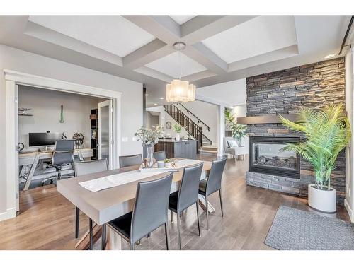 163 Cranarch Circle Se, Calgary, AB - Indoor Photo Showing Dining Room With Fireplace