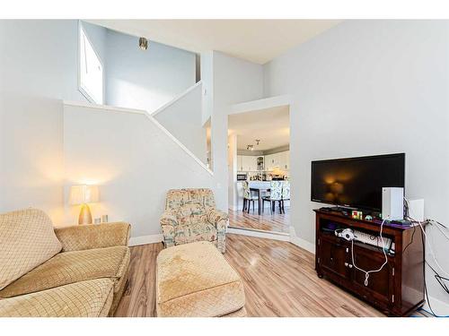 30 Hidden Crescent Nw, Calgary, AB - Indoor Photo Showing Living Room