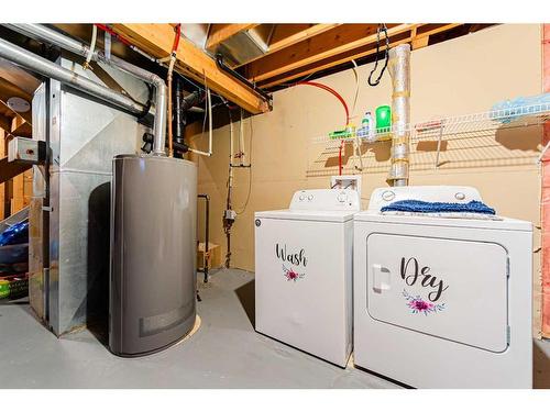 30 Hidden Crescent Nw, Calgary, AB - Indoor Photo Showing Laundry Room