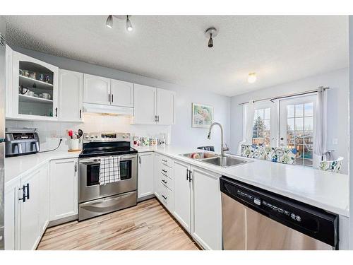 30 Hidden Crescent Nw, Calgary, AB - Indoor Photo Showing Kitchen With Stainless Steel Kitchen With Double Sink