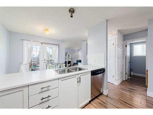 30 Hidden Crescent Nw, Calgary, AB - Indoor Photo Showing Kitchen With Double Sink