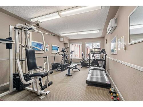 123-550 Prominence Rise Sw, Calgary, AB - Indoor Photo Showing Gym Room