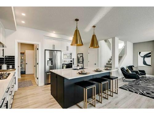 66 Ranchers View East, Okotoks, AB - Indoor Photo Showing Kitchen With Stainless Steel Kitchen With Upgraded Kitchen