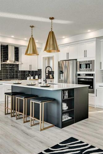 66 Ranchers View East, Okotoks, AB - Indoor Photo Showing Kitchen With Stainless Steel Kitchen With Upgraded Kitchen