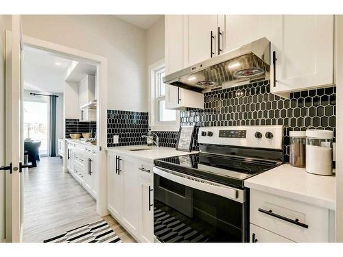 66 Ranchers View East, Okotoks, AB - Indoor Photo Showing Kitchen With Stainless Steel Kitchen With Upgraded Kitchen