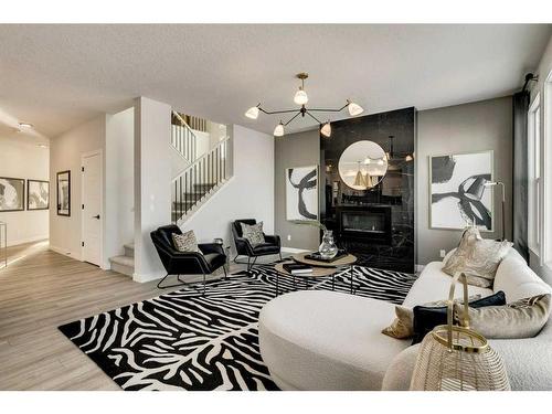 66 Ranchers View East, Okotoks, AB - Indoor Photo Showing Living Room With Fireplace