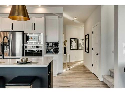 66 Ranchers View East, Okotoks, AB - Indoor Photo Showing Kitchen With Stainless Steel Kitchen With Upgraded Kitchen