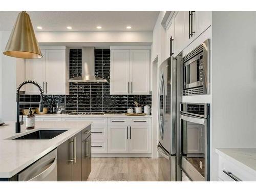 66 Ranchers View East, Okotoks, AB - Indoor Photo Showing Kitchen With Stainless Steel Kitchen With Upgraded Kitchen