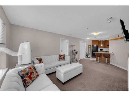 312-35 Richard Court Sw, Calgary, AB - Indoor Photo Showing Living Room