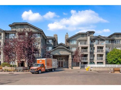 312-35 Richard Court Sw, Calgary, AB - Outdoor With Balcony With Facade