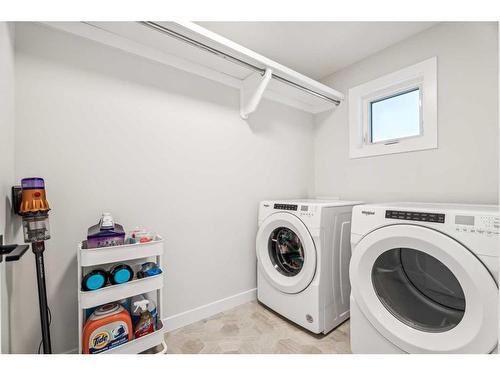 66 Precedence View, Cochrane, AB - Indoor Photo Showing Laundry Room