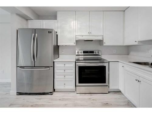 309-2309 Sienna Park Green Sw, Calgary, AB - Indoor Photo Showing Kitchen With Stainless Steel Kitchen