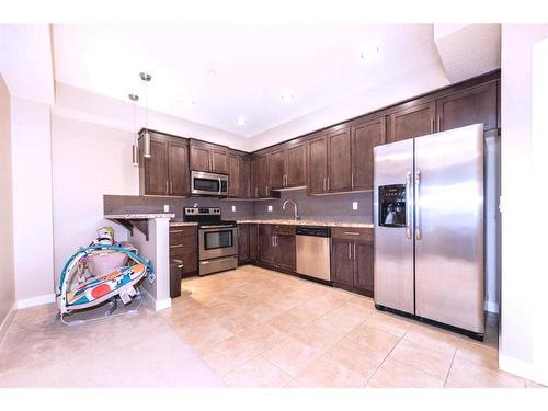 108-1005A Westmount Drive, Strathmore, AB - Indoor Photo Showing Kitchen