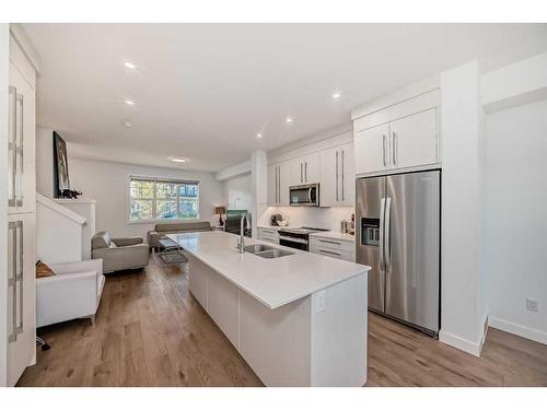 238 Dawson Way, Chestermere, AB - Indoor Photo Showing Kitchen With Double Sink With Upgraded Kitchen