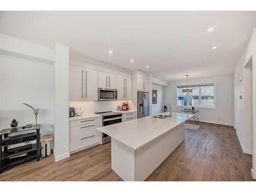 238 Dawson Way, Chestermere, AB - Indoor Photo Showing Kitchen With Double Sink With Upgraded Kitchen