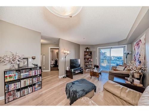 308-15 Saddlestone Way Ne, Calgary, AB - Indoor Photo Showing Living Room