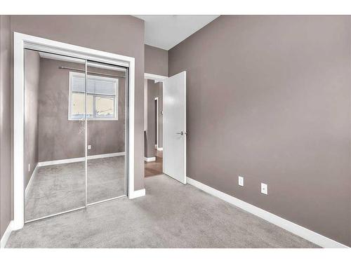 210-22 Auburn Bay Link Se, Calgary, AB - Indoor Photo Showing Other Room