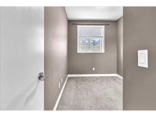 210-22 Auburn Bay Link Se, Calgary, AB - Indoor Photo Showing Other Room