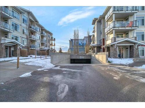 210-22 Auburn Bay Link Se, Calgary, AB - Outdoor With Balcony With Facade