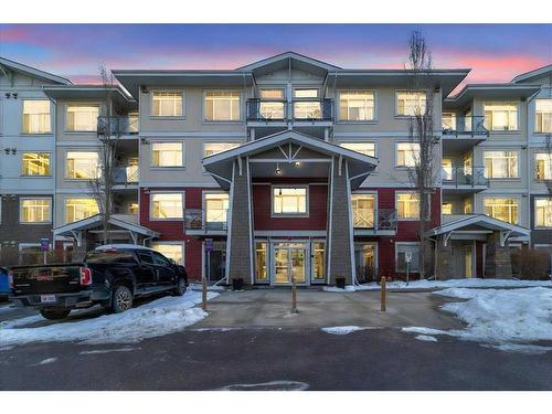 210-22 Auburn Bay Link Se, Calgary, AB - Outdoor With Balcony With Facade