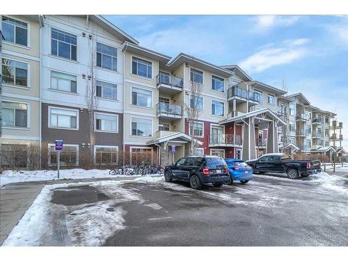 210-22 Auburn Bay Link Se, Calgary, AB - Outdoor With Balcony With Facade