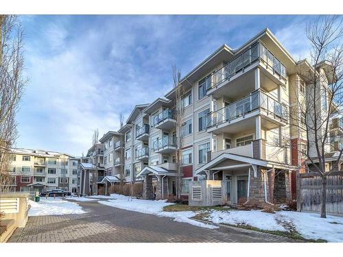 210-22 Auburn Bay Link Se, Calgary, AB - Outdoor With Balcony With Facade