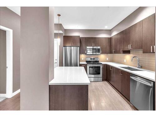 210-22 Auburn Bay Link Se, Calgary, AB - Indoor Photo Showing Kitchen With Stainless Steel Kitchen With Double Sink