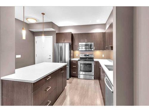 210-22 Auburn Bay Link Se, Calgary, AB - Indoor Photo Showing Kitchen With Stainless Steel Kitchen