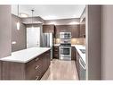 210-22 Auburn Bay Link Se, Calgary, AB  - Indoor Photo Showing Kitchen With Stainless Steel Kitchen 