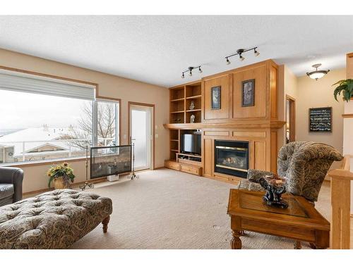 14 Eagleview Gate, Cochrane, AB - Indoor Photo Showing Living Room With Fireplace