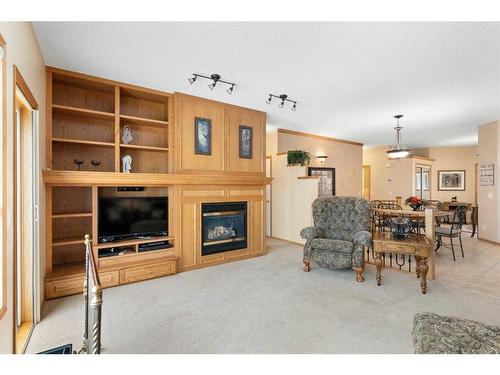 14 Eagleview Gate, Cochrane, AB - Indoor Photo Showing Living Room With Fireplace