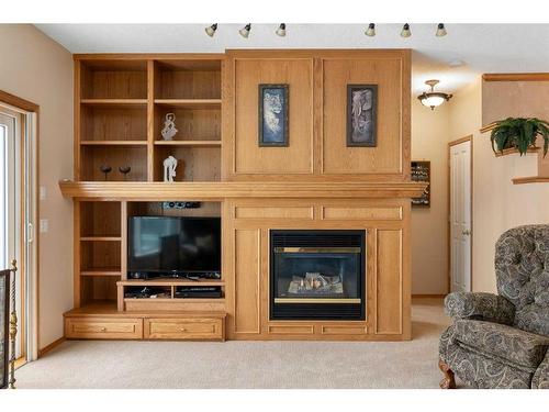 14 Eagleview Gate, Cochrane, AB - Indoor Photo Showing Living Room With Fireplace