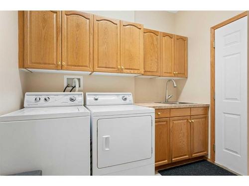 14 Eagleview Gate, Cochrane, AB - Indoor Photo Showing Laundry Room