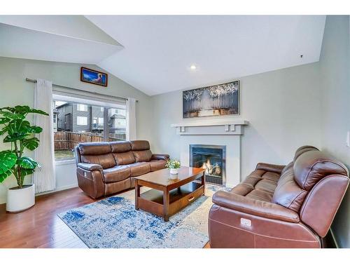 15 Sage Bank Road, Calgary, AB - Indoor Photo Showing Living Room With Fireplace