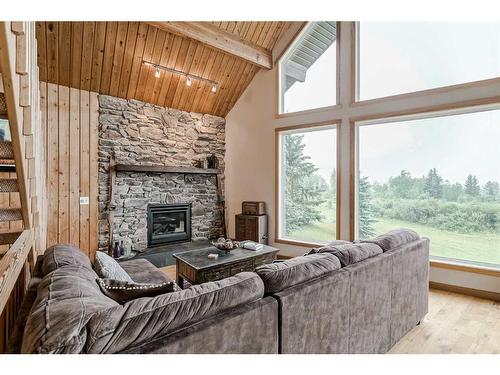 44092 & 44080 Township Road 274, Rural Rocky View County, AB - Indoor Photo Showing Living Room With Fireplace