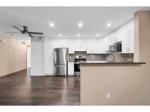 210-8535 Bonaventure Drive Se, Calgary, AB - Indoor Photo Showing Kitchen