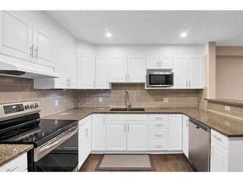 210-8535 Bonaventure Drive Se, Calgary, AB - Indoor Photo Showing Kitchen