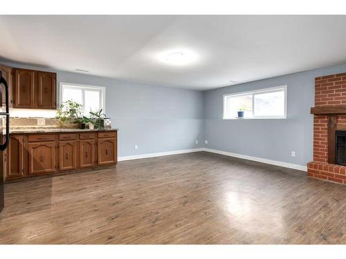 724 9Th Avenue Se, High River, AB - Indoor With Fireplace