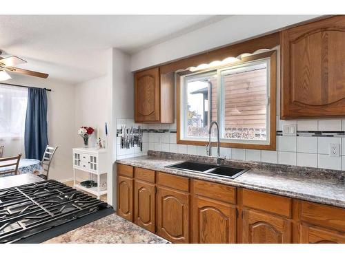 724 9Th Avenue Se, High River, AB - Indoor Photo Showing Kitchen With Double Sink