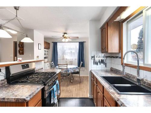 724 9Th Avenue Se, High River, AB - Indoor Photo Showing Kitchen With Double Sink