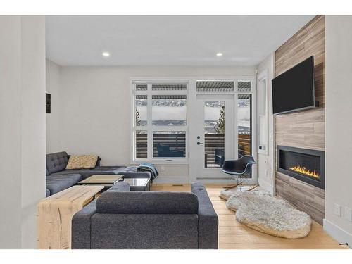 215 Riva Heights, Canmore, AB - Indoor Photo Showing Living Room With Fireplace