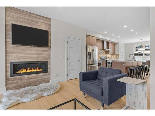 215 Riva Heights, Canmore, AB - Indoor Photo Showing Living Room With Fireplace