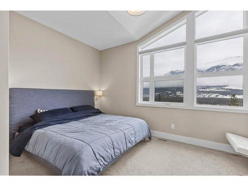 215 Riva Heights, Canmore, AB - Indoor Photo Showing Bedroom