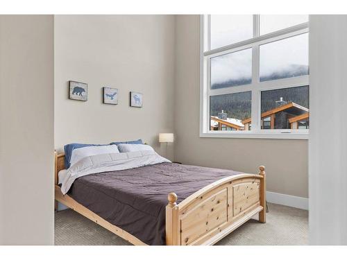 215 Riva Heights, Canmore, AB - Indoor Photo Showing Bedroom