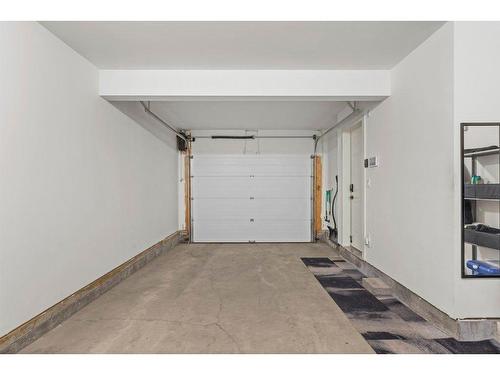 215 Riva Heights, Canmore, AB - Indoor Photo Showing Garage