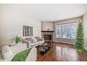 2416 1 Avenue Nw, Calgary, AB  - Indoor Photo Showing Living Room With Fireplace 