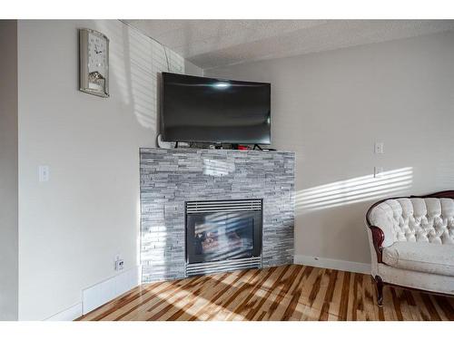 53 Martinbrook Road Ne, Calgary, AB - Indoor Photo Showing Living Room With Fireplace