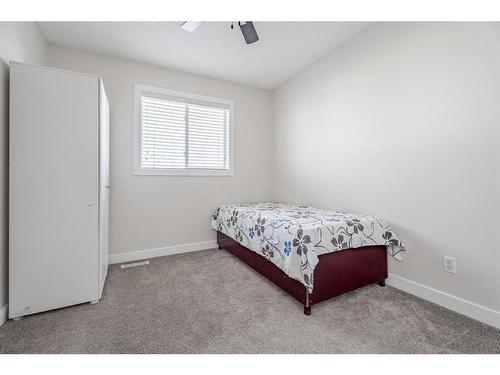 53 Martinbrook Road Ne, Calgary, AB - Indoor Photo Showing Bedroom