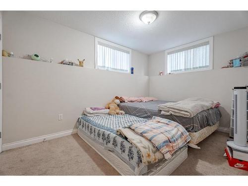 53 Martinbrook Road Ne, Calgary, AB - Indoor Photo Showing Bedroom